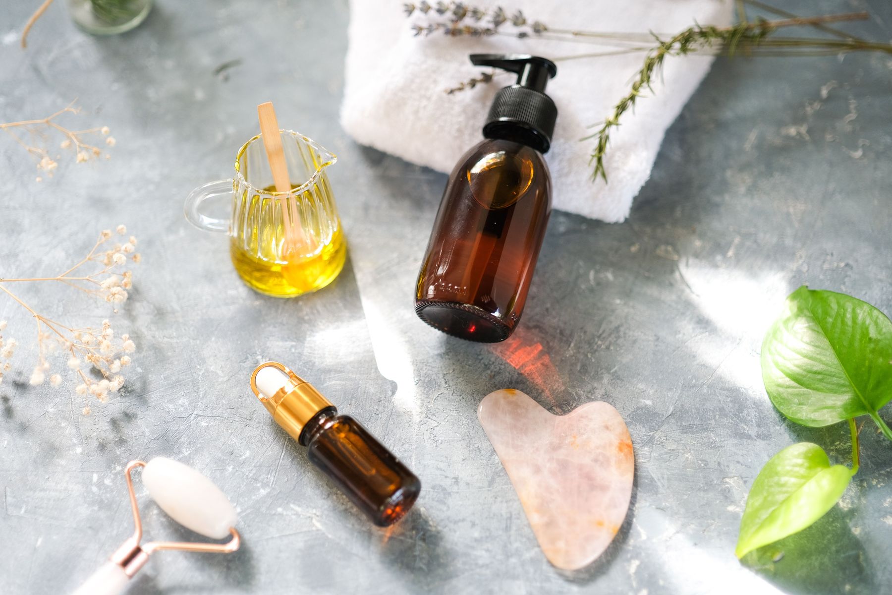 Oils, hot stones, and towels prepared for a restorative wellness treatment