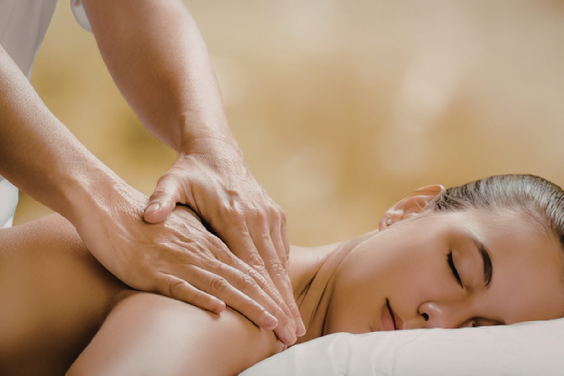 Client resting peacefully during a shoulder massage